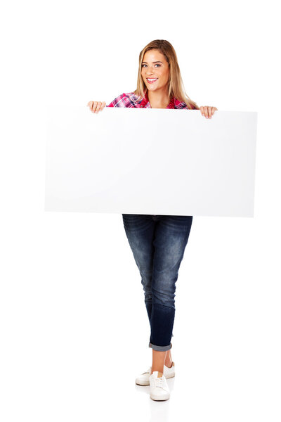 Young smiling woman holding empty banner