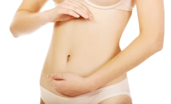 Young woman belly with hand on it — Stock Photo, Image
