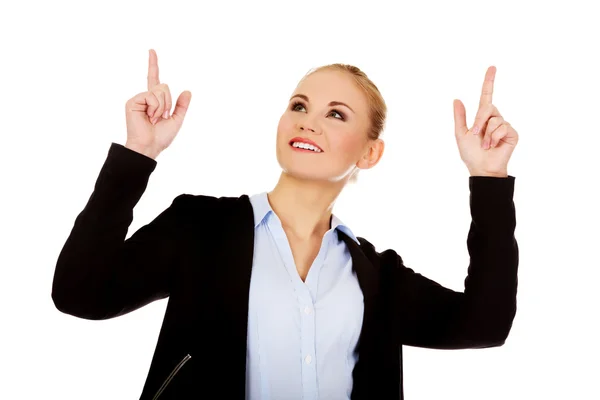 Young smiling business woman pointing up — Stock Photo, Image