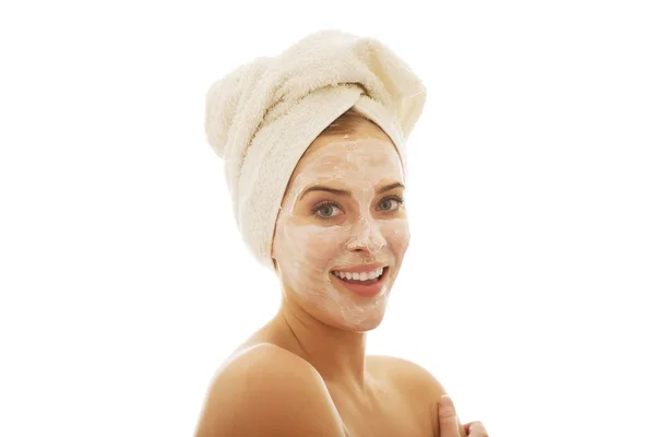 Smiling woman with face cream — Stock Photo, Image