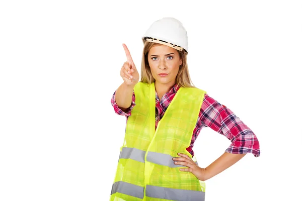 Female builder shows one finger — Stock Photo, Image