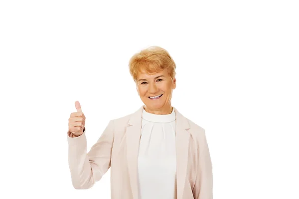Smile elegant senior woman showing thumb up — Stock Photo, Image