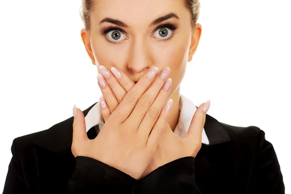 Young businesswoman covering with hand her mouth. Speak no evil concept — Stock Photo, Image