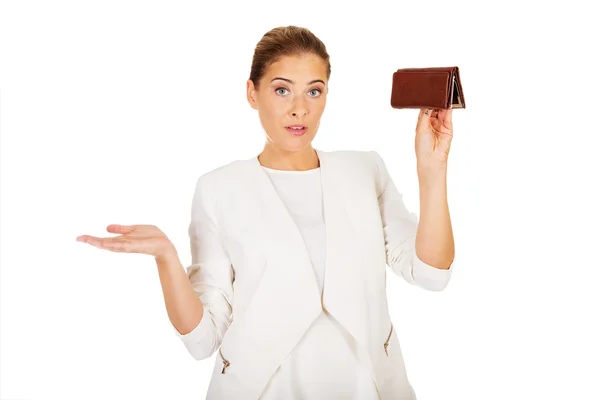 Young businesswoman holds empty wallet — Stock Photo, Image