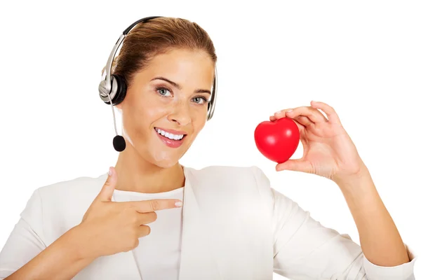 Feliz call center mujer con corazón juguete —  Fotos de Stock