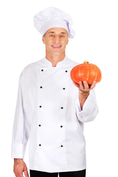 Mannelijke chef-kok met een pompoen — Stockfoto