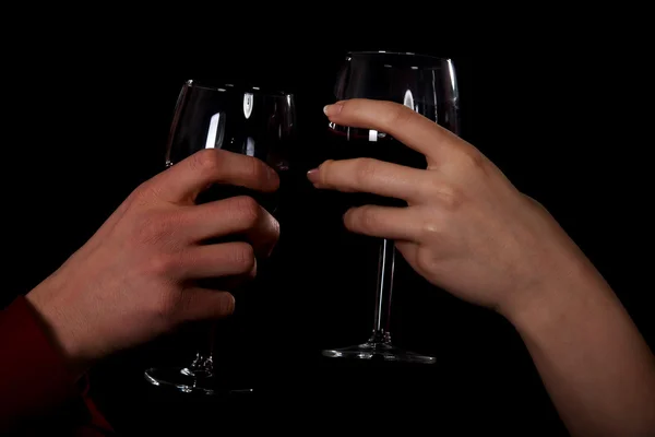 Couple with wine by a table. — Stock Photo, Image