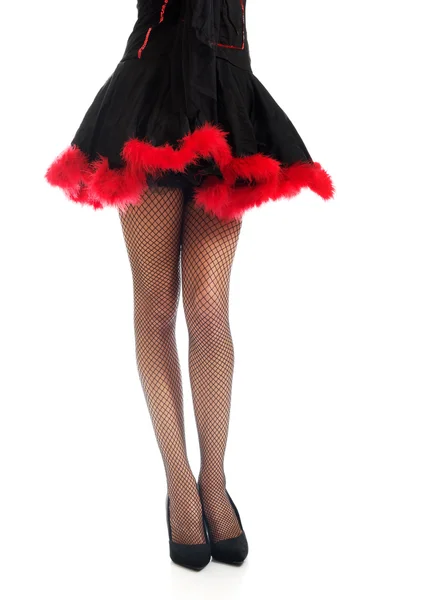 Woman legs wearing devil clothes — Stock Photo, Image