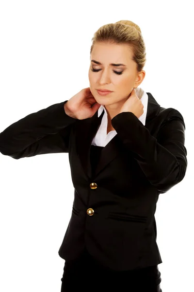 Businesswoman having huge neck ache — Stock Photo, Image