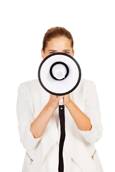 Young businesswoman holding megaphone — Stock Photo, Image