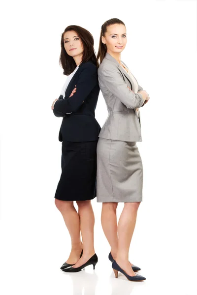 Two businesswoman leaning on each other. — Stock Photo, Image