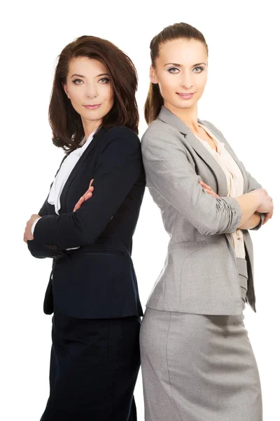 Two businesswoman leaning on each other. — Stock Photo, Image