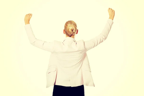 Visão traseira da mulher de negócios feliz com braços para cima — Fotografia de Stock