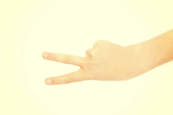 Woman hand shows two fingers - victory sign