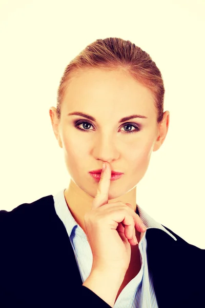 Business woman making silent sign with finger on lips — Stock Photo, Image