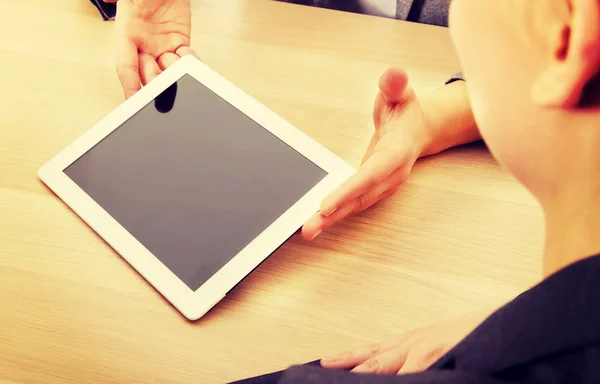 Business meeting-man showing something on tablet — Stock Photo, Image