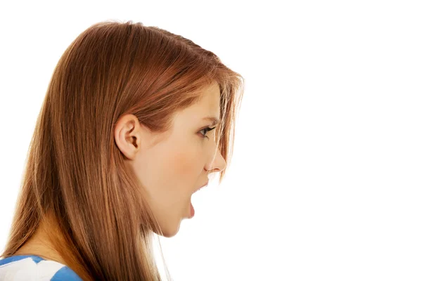 Angry young woman screaming for someone — Stock Photo, Image