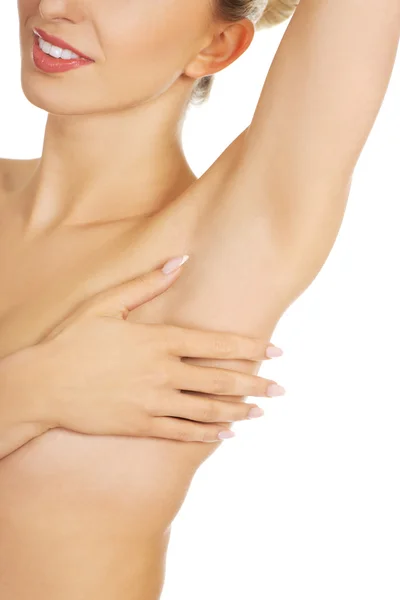 Beautiful woman examining her breast. — Stock Photo, Image