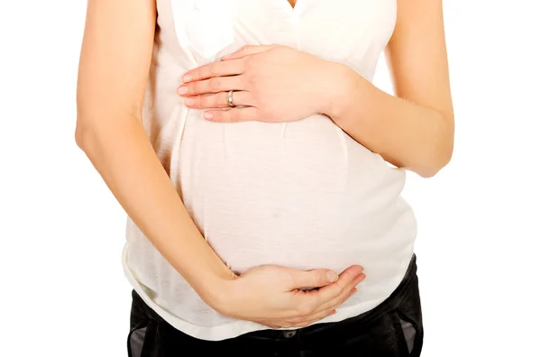 Terhes nő tartja a hasát — Stock Fotó