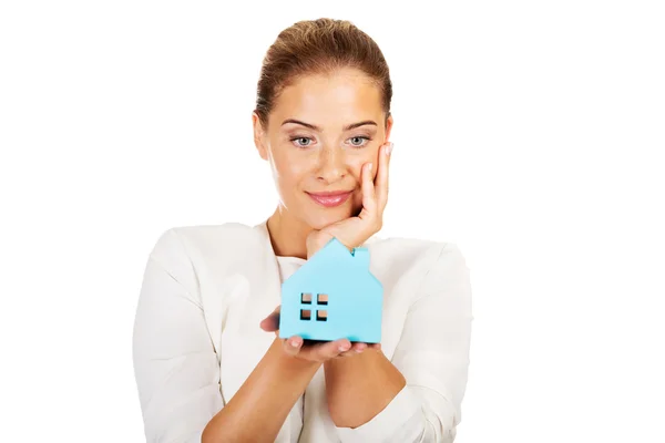Smile businesswoman holding a paper house — Stock Photo, Image