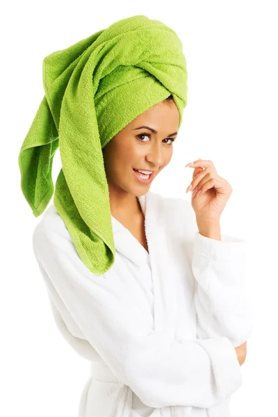 Woman in bathrobe looking at camera — Stock Photo, Image