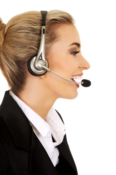 Glückliche junge Geschäftsfrau mit Headset — Stockfoto