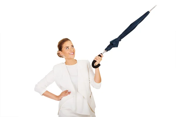 Businesswoman pointing for something umbrella — Stock Photo, Image