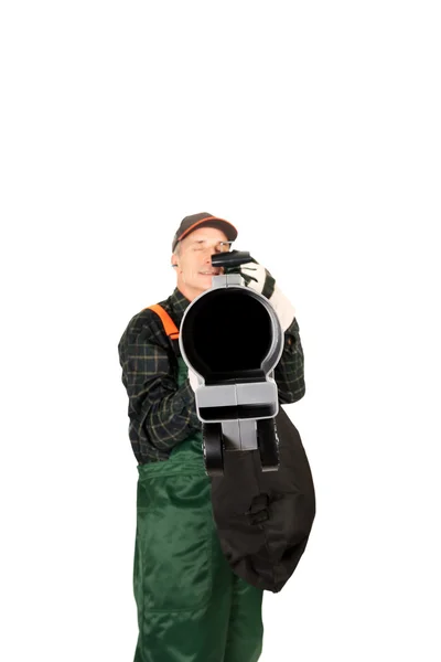 Worker in uniform with a leaf blower — Stock Photo, Image