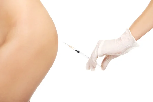 Инъекции перед операцией на женской заднице — стоковое фото