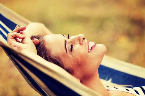 Young blonde woman resting on hammock — Stock Photo, Image