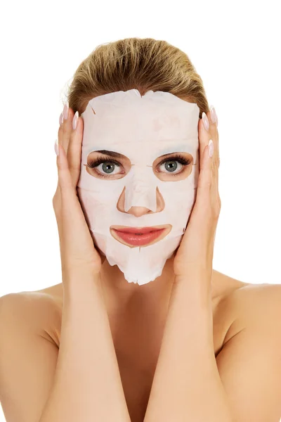 Young woman with facial mask — Stock Photo, Image