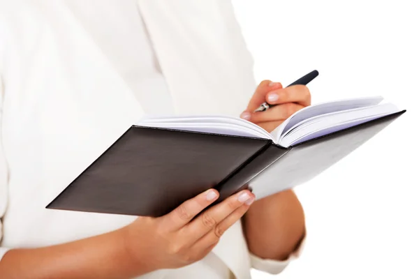 Young businesswoman makes a notes — Stock Photo, Image