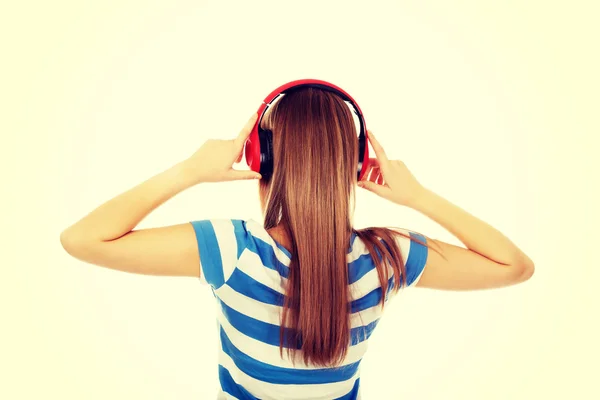 Teenage woman with red headphones — Stock Photo, Image