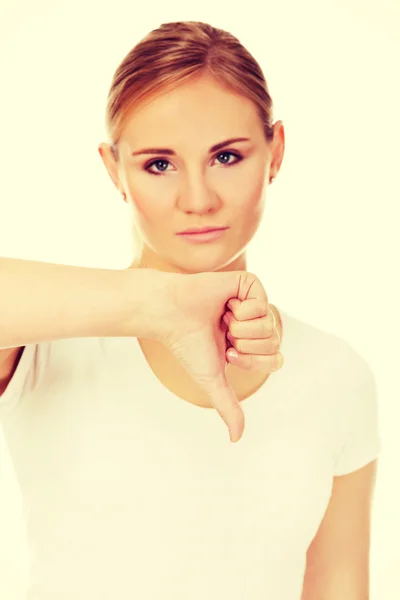 Junge unglückliche Frau zeigt Daumen nach unten — Stockfoto