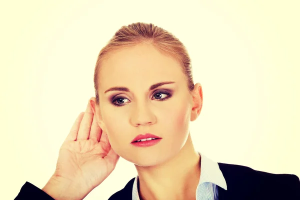 Young business woman overhears a conversation — Stock Photo, Image