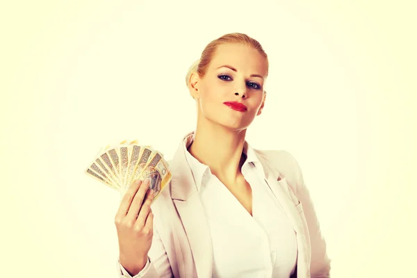 Γυναίκα σε εργασία ευτυχισμένη κρατώντας ένα κλιπ χρήματα Πολωνικά — Φωτογραφία Αρχείου