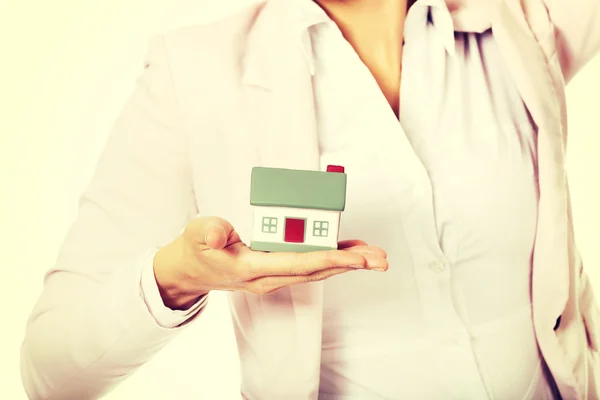 Business woman holding a house model — Stock Photo, Image
