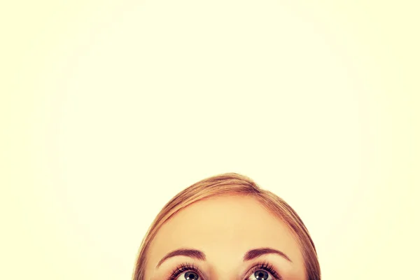 Young woman eyes looking up — Stock Photo, Image