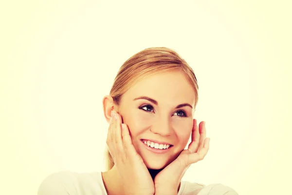 Young happy woman holding both hands on cheeks — Stock Photo, Image