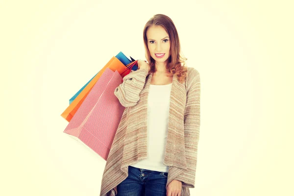 Gelukkige vrouw met boodschappentassen. — Stockfoto