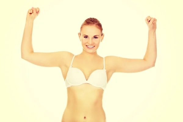 Mujer atlética en ropa interior blanca muestra sus músculos —  Fotos de Stock