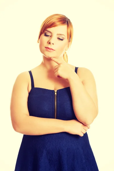 Thoughtful plus size woman — Stock Photo, Image