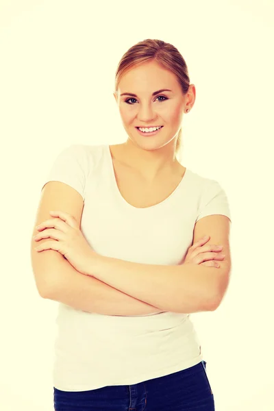 Happy young woman wiyh folded arms — Stock Photo, Image