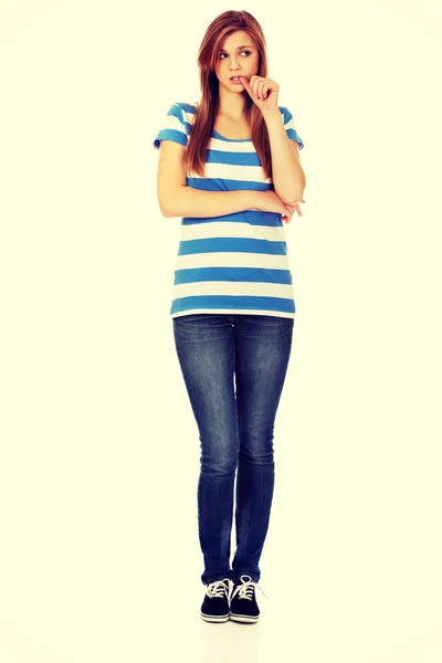 Worried teenage woman with folded arms — Stock Photo, Image