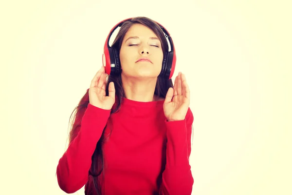 Mulher com fones de ouvido ouvir música. — Fotografia de Stock