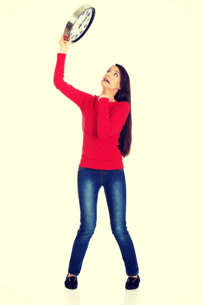 Beautiful woman with the clock. — Stock Photo, Image