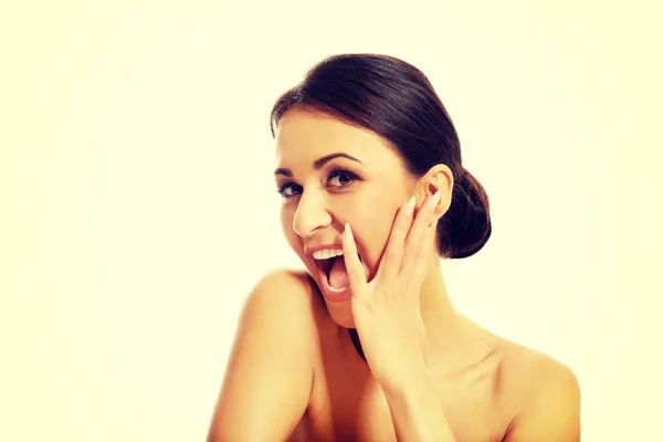 Beautiful laughing spa woman, touching her face — Stock Photo, Image