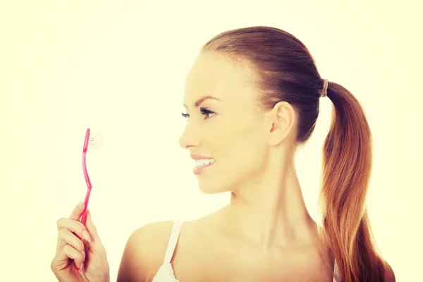 Hermosa mujer con cepillo de dientes . —  Fotos de Stock