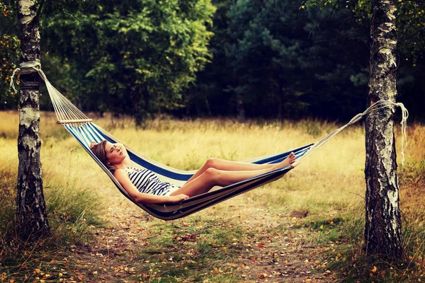 Young blonde woman resting on hammock — Stock Photo, Image