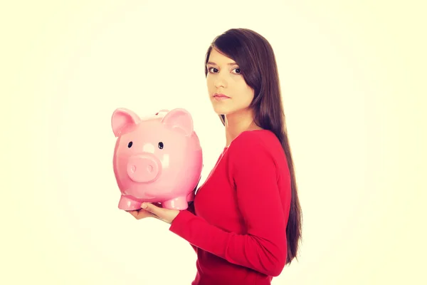 Happy young woman with piggybank. — Stock Photo, Image